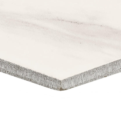 Corner of a ceramic tile showing the thickness.
